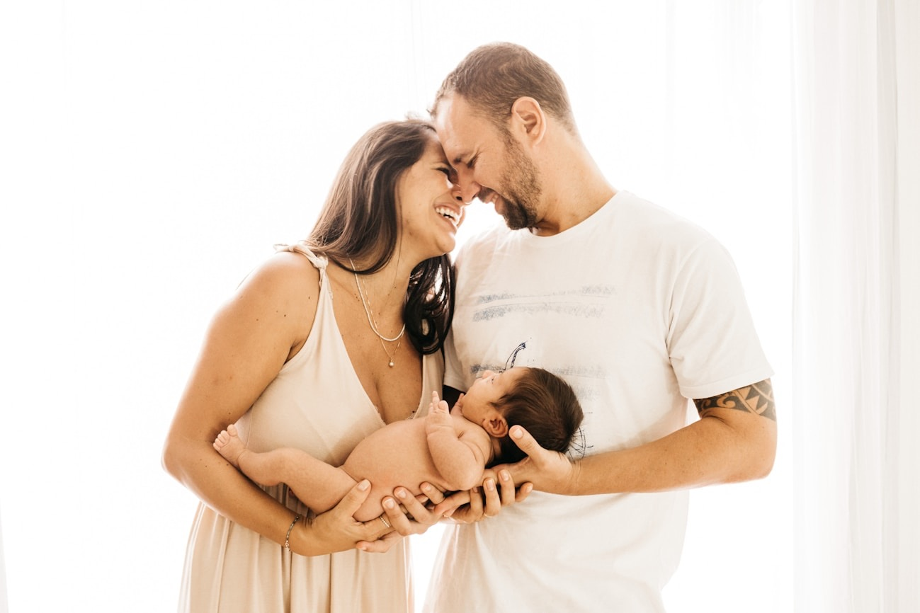 Parents holding their newborn